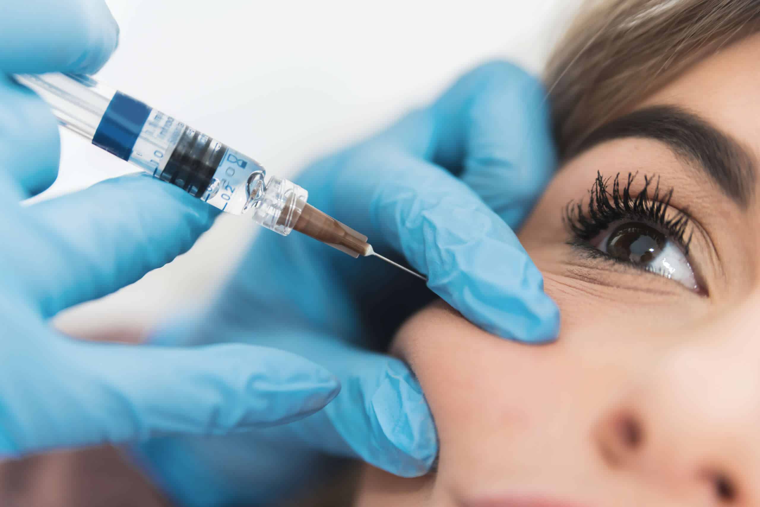 close,up,of,young,woman,having,cheek,fillers,done.